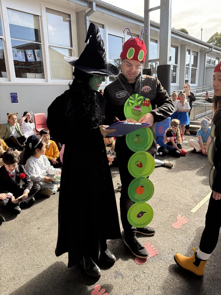 Teachers dressed as the Wicked Witch and the Very Hungry Caterpillar at the school Book Week parade.